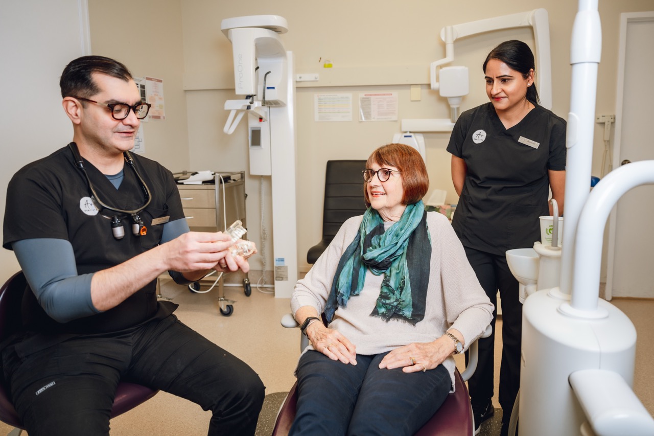 Dentist explaining findings during an exam